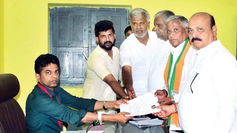 Battle for Ballot at Varuna Constituency: BJP’s Somanna files nomination accompanied by CM Bommai